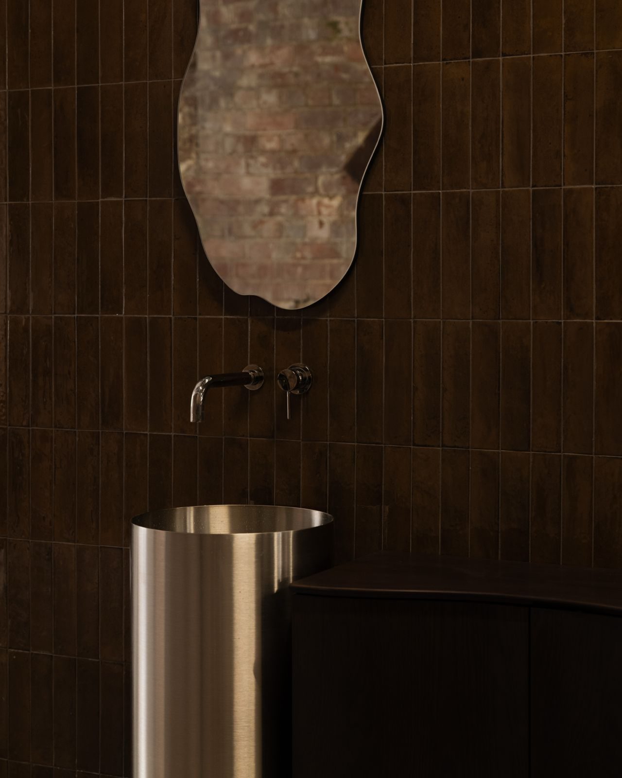 First White Cloth Hall — washroom with sculpted mirror and stainless basin